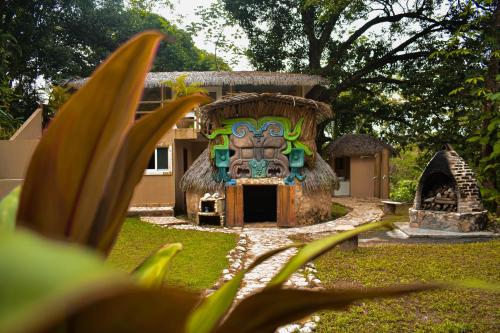 a small house with a painting on the front of it at Hotel Villa Mercedes Palenque in Palenque
