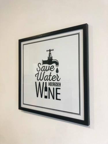 a framed picture of a wine sign on a wall at Pozzuoli B&B exSofer in Pozzuoli