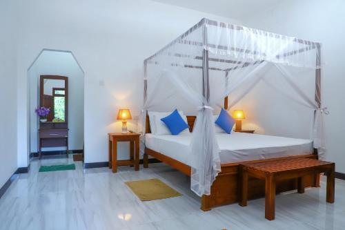 Gulta vai gultas numurā naktsmītnē The Cattleya Guest House Sigiriya