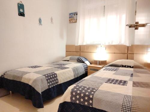Ένα ή περισσότερα κρεβάτια σε δωμάτιο στο ACV - Cala Blanca II - 1ª linea planta 5 sur