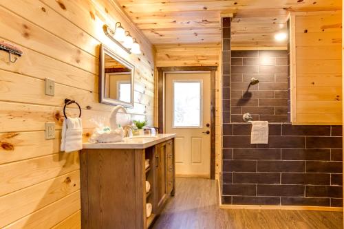 a bathroom with a sink and a shower at Route 66 Cabin in Pigeon Forge