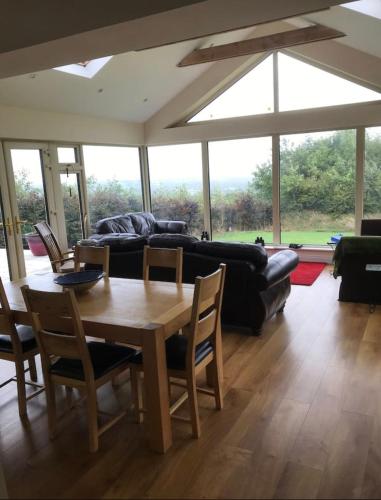 a living room with a table and a couch at Peaceful in Myshall