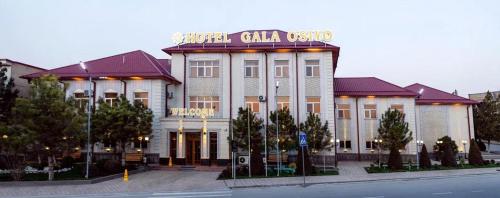 a building with a sign on top of it at Gala Osiyo Samarkand in Samarkand