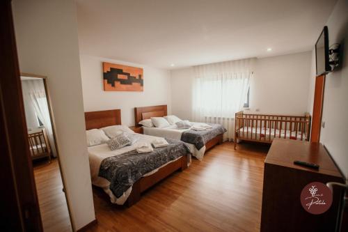 Casa da Adega - Quinta da Portela tesisinde bir odada yatak veya yataklar