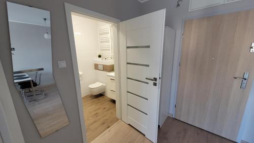 Ein Badezimmer in der Unterkunft Apartament Miodowy Dom