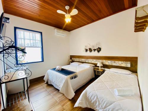 Cama ou camas em um quarto em Pousada Solar Das Gerais