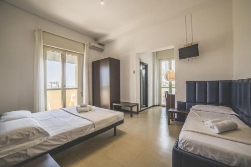 Postel nebo postele na pokoji v ubytování Hotel Splendid