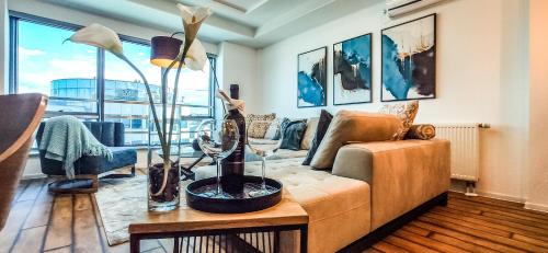 a living room with a couch and a table at City Vibe in Brčko