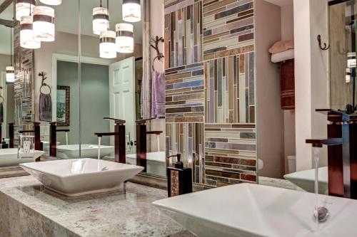 a bathroom with a sink and a large mirror at Longbranch 317 Evergreen Condo Nice Location Updates in Breckenridge
