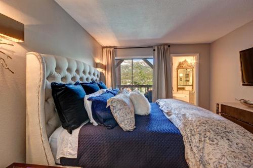 a bedroom with a bed with pillows on it at Longbranch 317 Evergreen Condo Nice Location Updates in Breckenridge