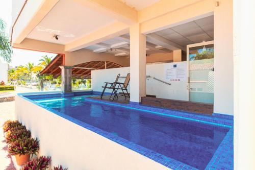 a villa with a swimming pool in a resort at Marina Banderas Suites Hotel Boutique in Nuevo Vallarta