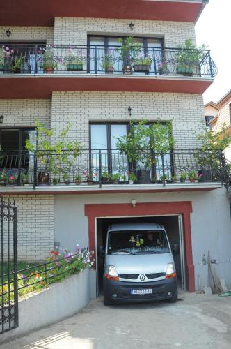 a silver van parked inside of a building at Smeštaj - sobe MARVEL in Niš
