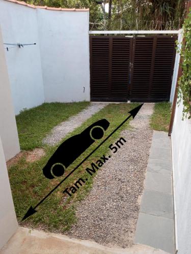 a sign that reads ten million sun in front of a yard at Suíte Independente - Praia Indaiá e Riviera - MarDoceLar Bertioga in Bertioga
