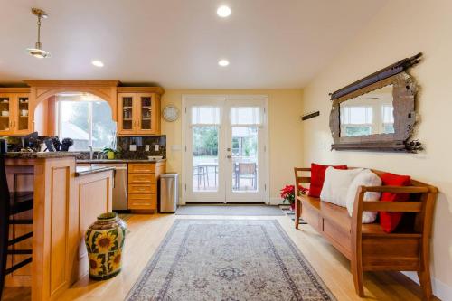 a kitchen with a couch and a table in a room at Sonoma Wine Country Bungalow in Sonoma