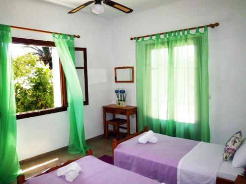 Ένα ή περισσότερα κρεβάτια σε δωμάτιο στο Paraskevi Apartments