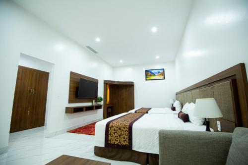 Ένα ή περισσότερα κρεβάτια σε δωμάτιο στο Nhat Quang Hotel