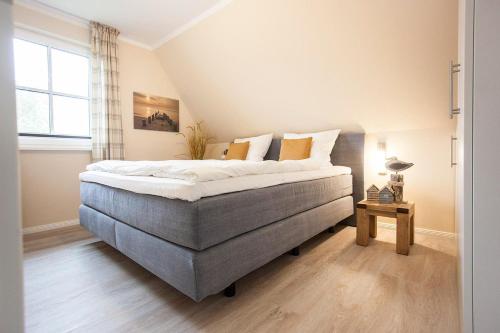 Ένα ή περισσότερα κρεβάτια σε δωμάτιο στο Ferienhaus Seeschwalbe 37