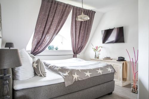 Een bed of bedden in een kamer bij Ferienhaus Haubenlerche 32