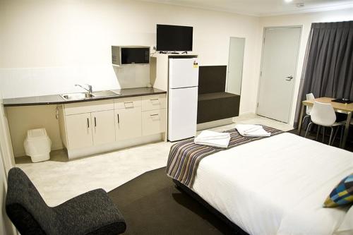 Ένα ή περισσότερα κρεβάτια σε δωμάτιο στο Roma Central Motel