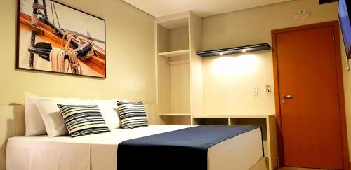 Cama ou camas em um quarto em Hotel Pousada Paradise