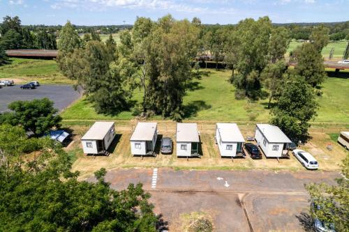 an aerial view of a group of mobile homes in a parking lot at Western Plains Tourist Park - Dubbo in Dubbo