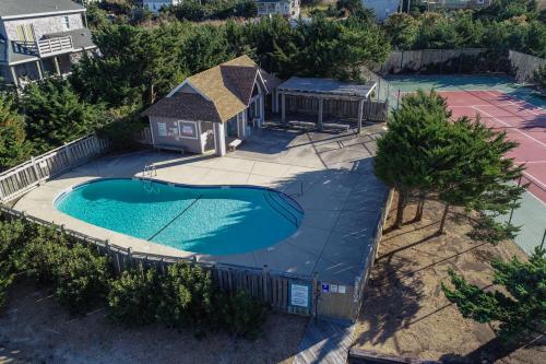 an overhead view of a swimming pool with a gazebo at Sans Souci 221 in Waves
