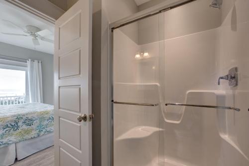 a bathroom with a shower with a glass door at The Kinnakeeter 107 in Avon