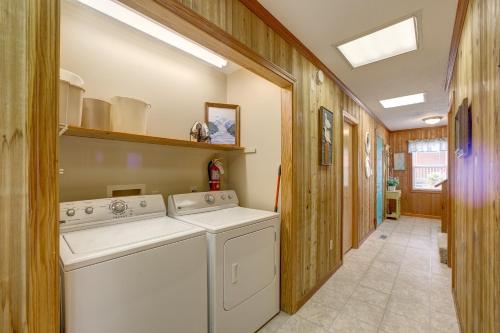 a laundry room with a washer and dryer at Sandfiddler 175 in Avon