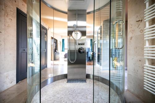 a hallway with a glass shower in a house at PETALS TOKYO - Floating Hotel in Tokyo