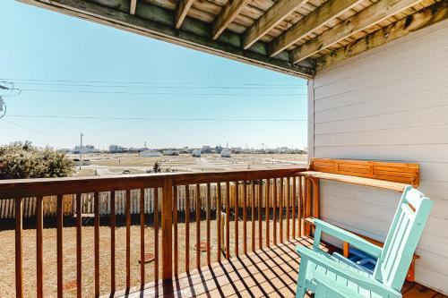 a porch with a bench and a view of an airport at Oceanside Fun 952 RR in Rodanthe