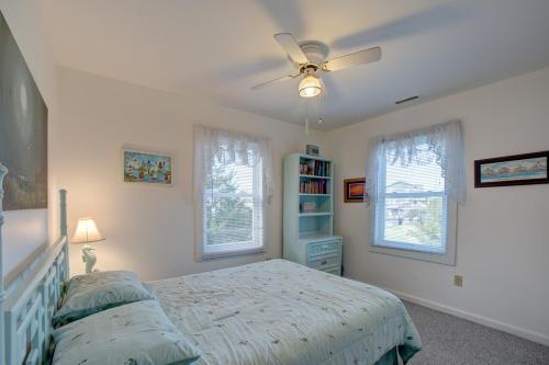 a bedroom with a bed and a ceiling fan at Diamond Shoals 67 in Avon