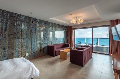 Ένα ή περισσότερα κρεβάτια σε δωμάτιο στο SongJeong Olla Hotel