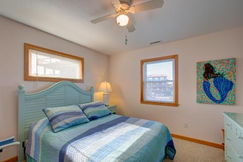 a bedroom with a bed and a ceiling fan at Whale Inn 208 in Avon