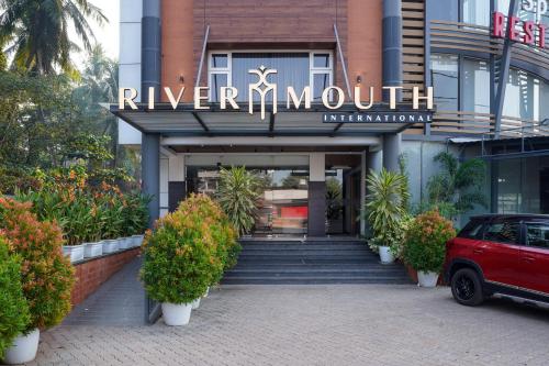 a building with a sign that reads river nourishment at Nexstay River Mouth International in Ferokh