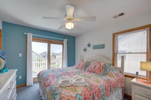 a bedroom with a bed and a ceiling fan at Out of the Blue 574 in Rodanthe