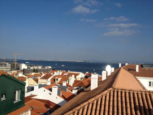 
a large building with a view of the ocean at Like Home - Santos in Lisbon
