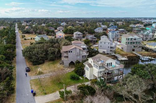 an aerial view of a town with houses and a river at Horizon House 405 in Frisco