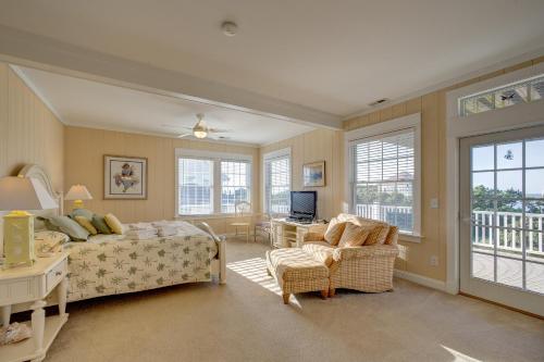 a bedroom with a bed and a couch and a chair at Spy Dog 837 in Frisco