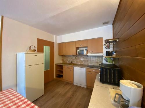 Кухня або міні-кухня у Appartements avec draps inclus dans le tarif