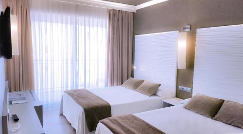 Postel nebo postele na pokoji v ubytování Hotel Augustus