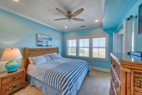 a bedroom with a bed and a ceiling fan at Seas the Day 991 RR in Rodanthe