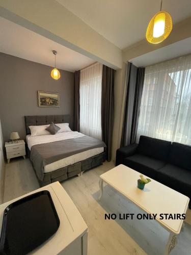 A bed or beds in a room at Oldmile Palace Hotel