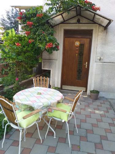 a table and chairs sitting on a patio at TILIA Apartmet in Struga