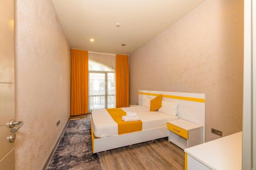 Postel nebo postele na pokoji v ubytování Agora Suites