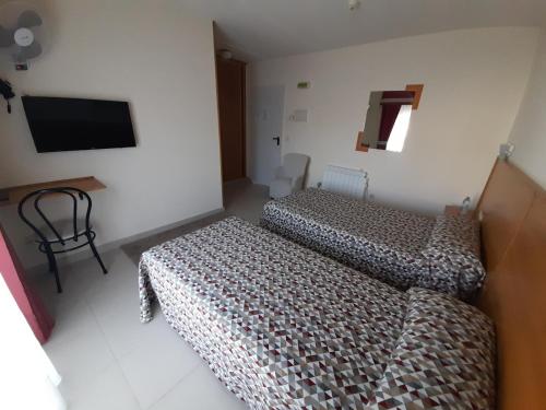 Ένα ή περισσότερα κρεβάτια σε δωμάτιο στο Hotel Valdoviño