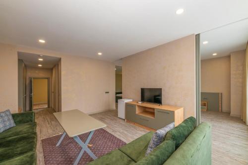 TV a/nebo společenská místnost v ubytování Agora Suites