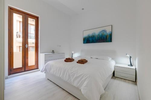 Postelja oz. postelje v sobi nastanitve Modern Apartment in the Best Area of Sliema