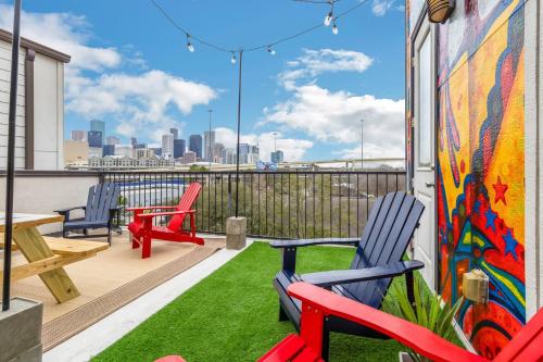 a balcony with chairs and a view of the city at Modern, Houston Inspired House with Best Views of Downtown! - Less than 1 mile to Eado Midtown Bars home in Houston
