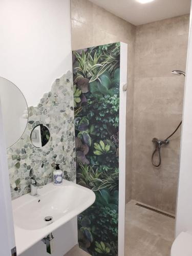 a bathroom with a sink and a shower at Obzor Tatyana Apartaments Natura in Obzor