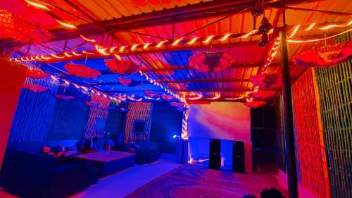 a room with red and blue lights in it at Gypsy Diaries Varanasi in Varanasi